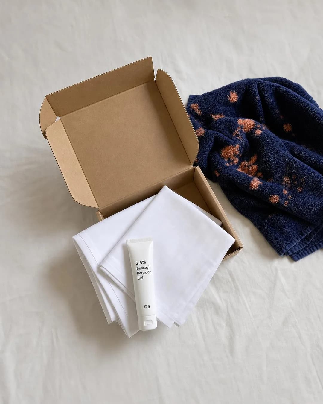 Flat-lay / unboxing shot, portrait 4:5. Managing active breakouts shouldn’t force you into an annoying nightly compromise with faded, crusty bathroom linens.