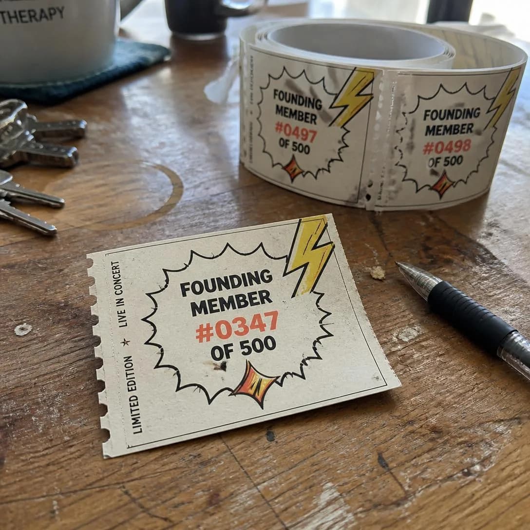 A raw, slightly soft-focus phone snapshot taken casually on a messy kitchen table — the kind of quick pic someone fires off to a friend